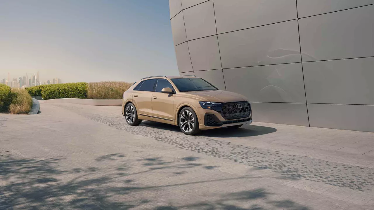 Side view of an Audi Q8 parked.