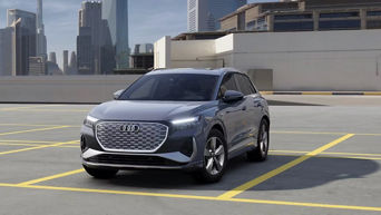 Three quarter profile view of an Audi Q4 e-tron parked.