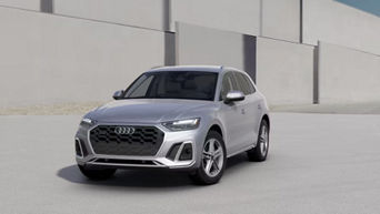 Three quarter profile view of an Audi Q5, parked.