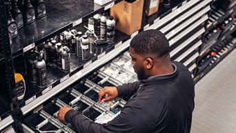 Service technician selecting vehicle pieces.