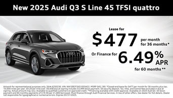 Side view of an Audi Q3 parked.