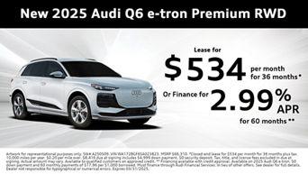 Side view of an Audi Q6 e-tron parked.