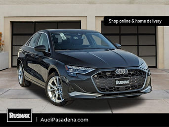 Left side profile of an Audi Q6 e-tron accelerating.