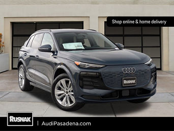 Side profile view of an Audi Q6 e-tron. 