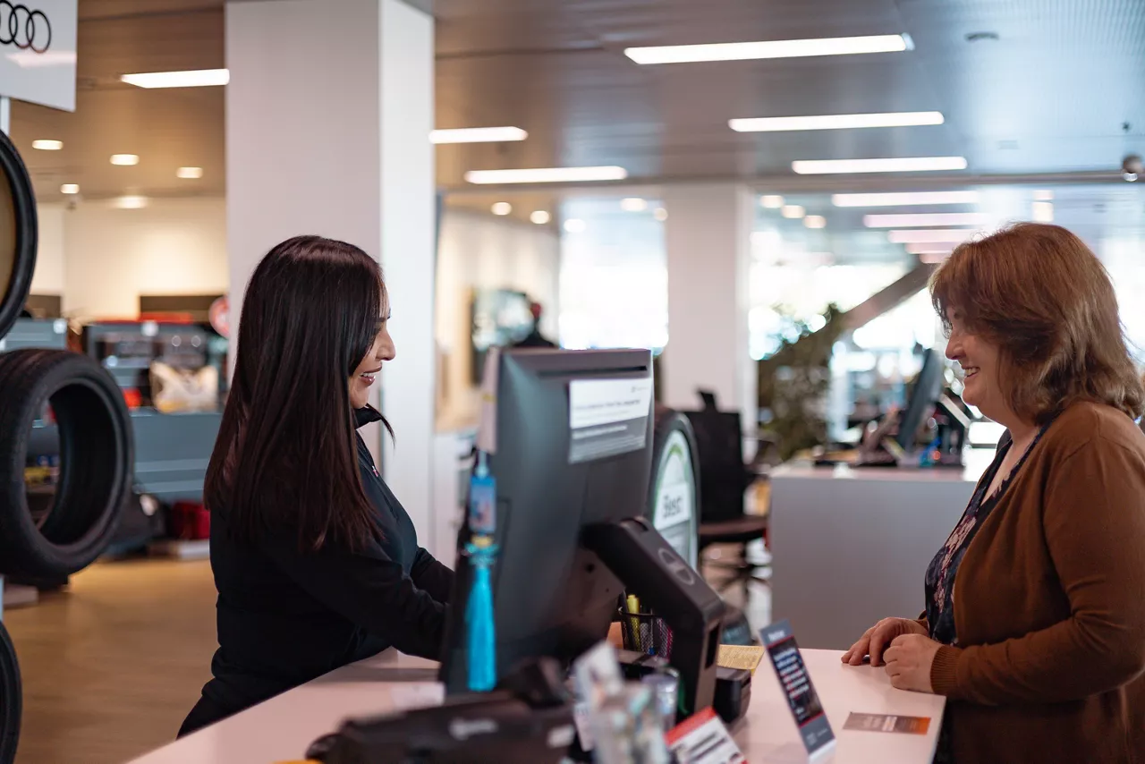 Audi customer with Audi employee in service.