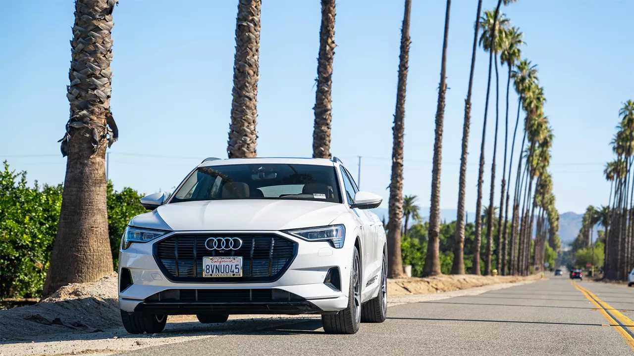 Three quarter view of an Audi q7 vehicle parked.