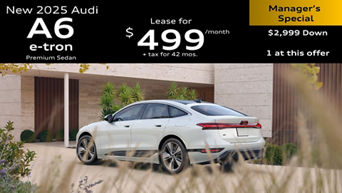 Left side profile of an Audi A6 accelerating.