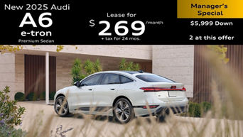 Left side profile of an Audi A6 accelerating.