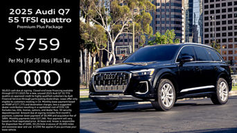 Front facing view of an Audi Q7 accelerating.