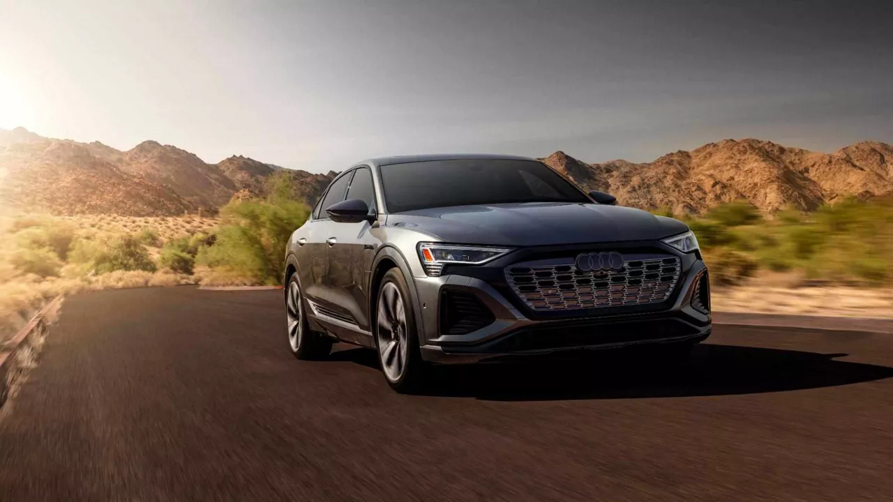 Front profile view of an Audi Q8 E-tron accelerating