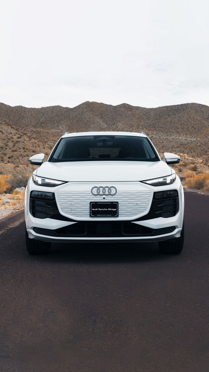 Front profile view of an Audi parked.