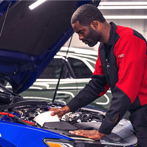 Audi technician changing air filter