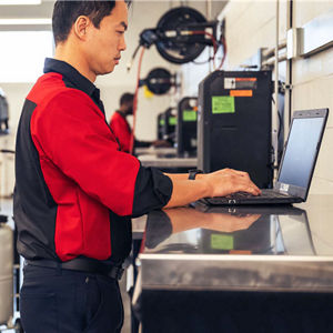 Audi technician looking at laptop