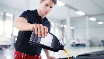 Service technician servicing tire.