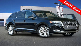 Side profile view of Audi Q7 parked.