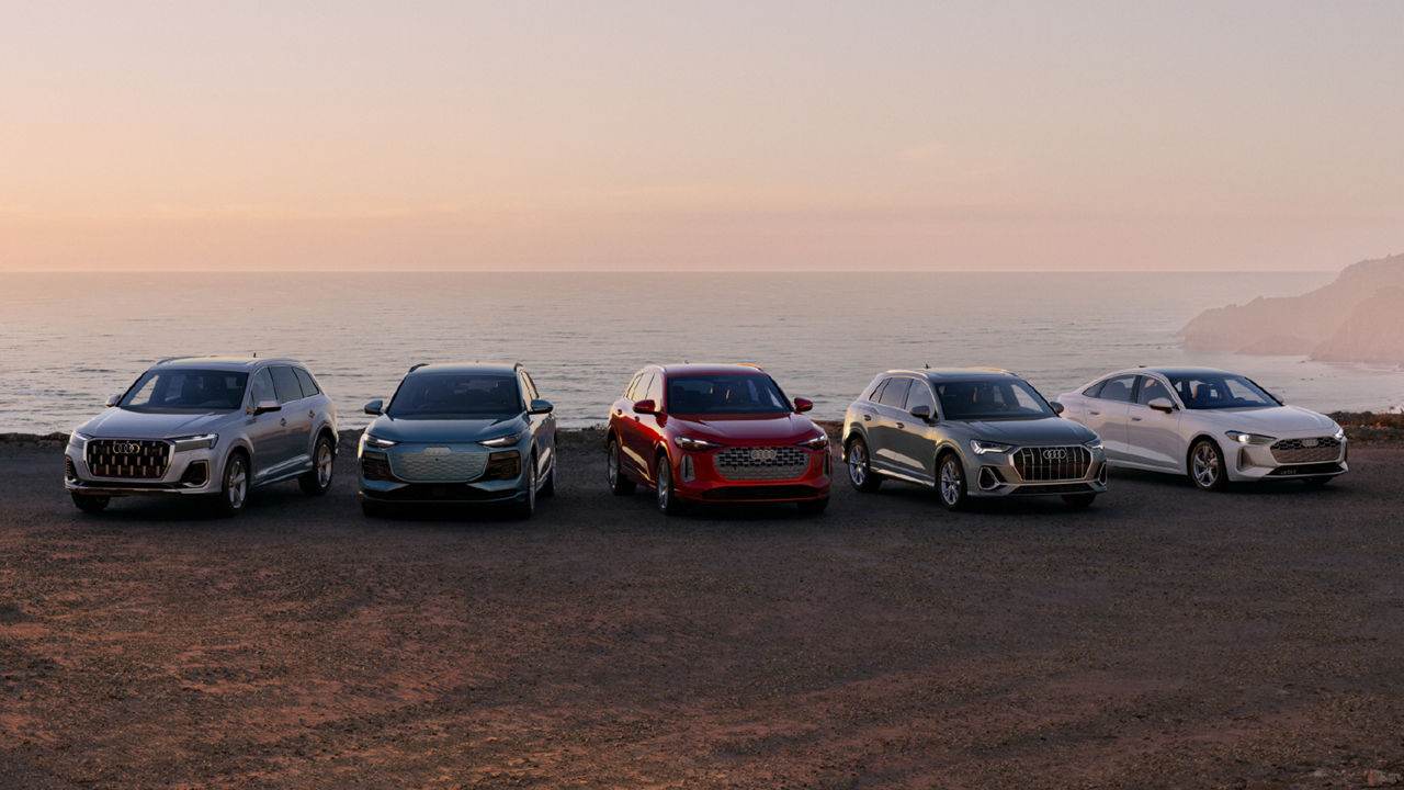 Front view of Audi models parked.