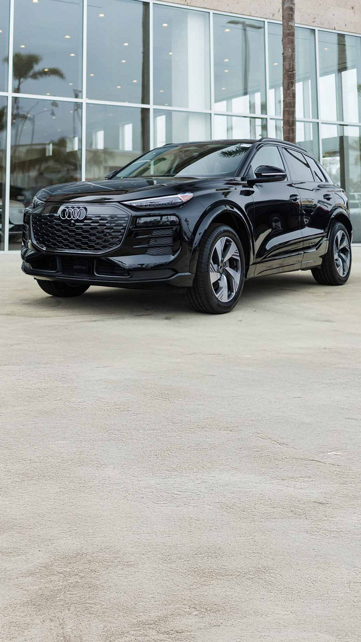 Right profile view of an Audi vehicle parked.