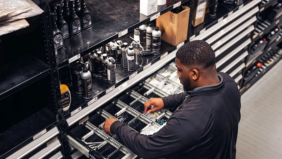 Audi service technician servicing.