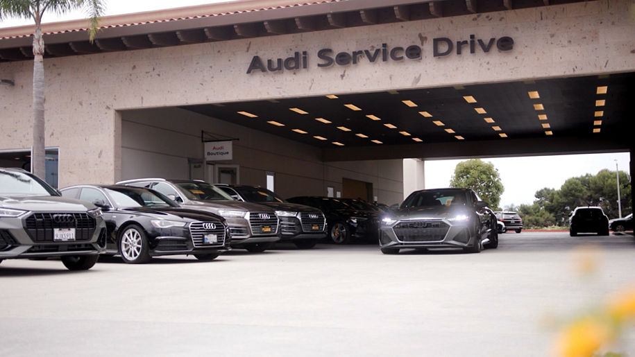 Front profile view of an Audi vehicle in the service drive.