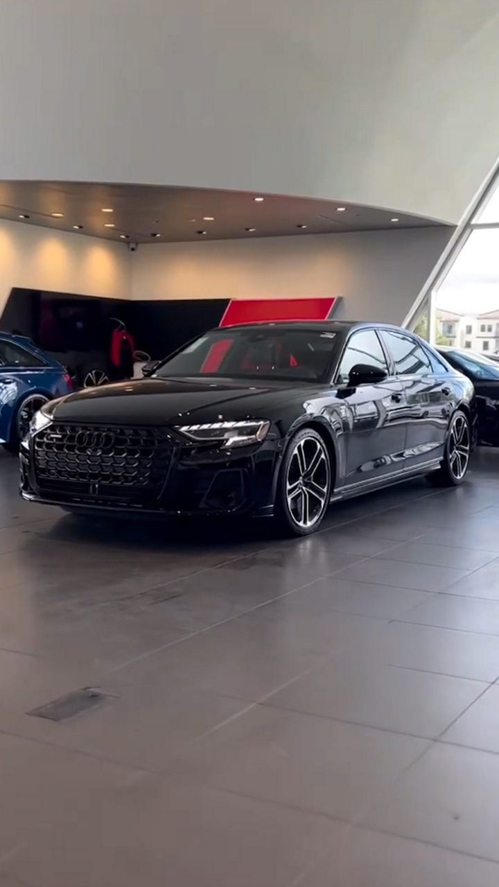Profile view of an Audi vehicle parked.