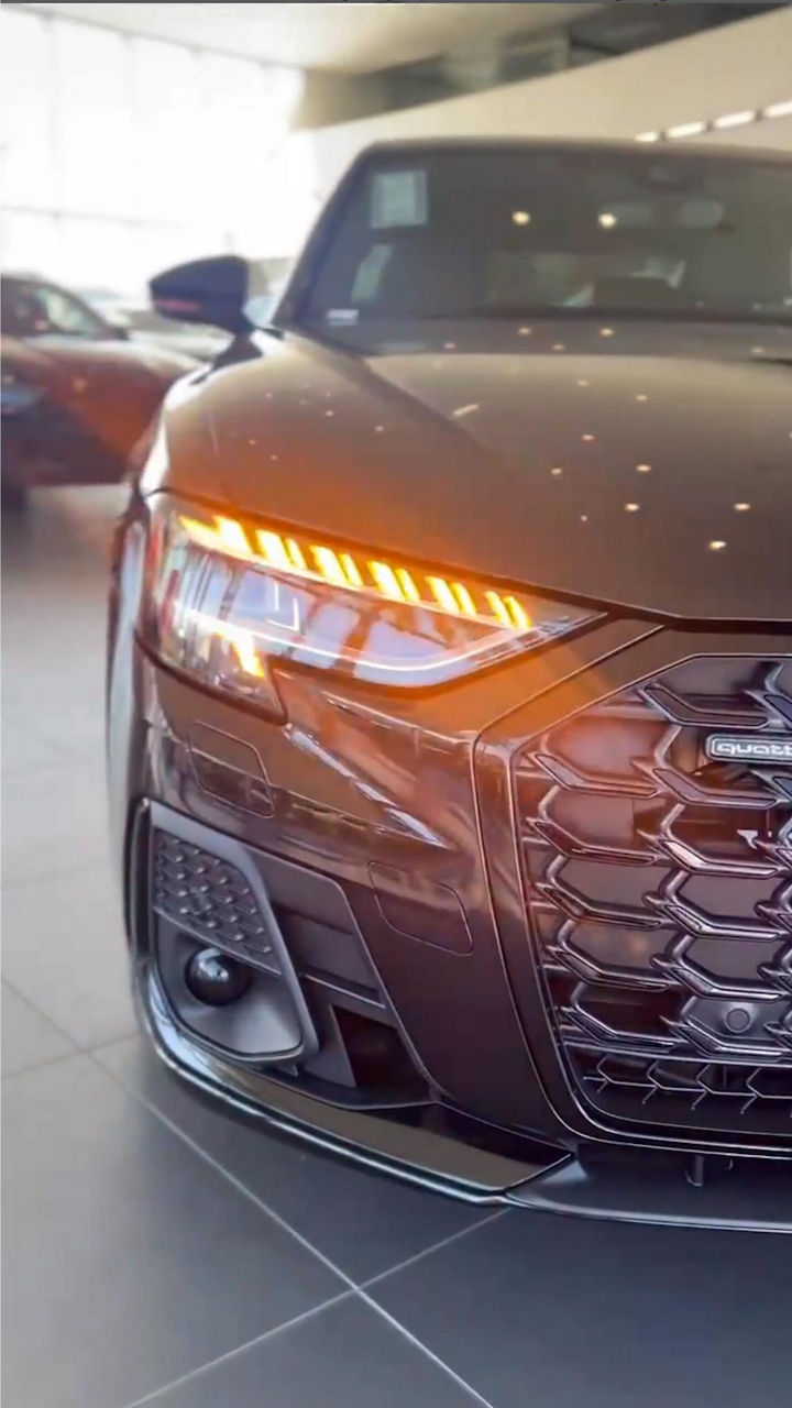 Profile view of Audi vehicle. 