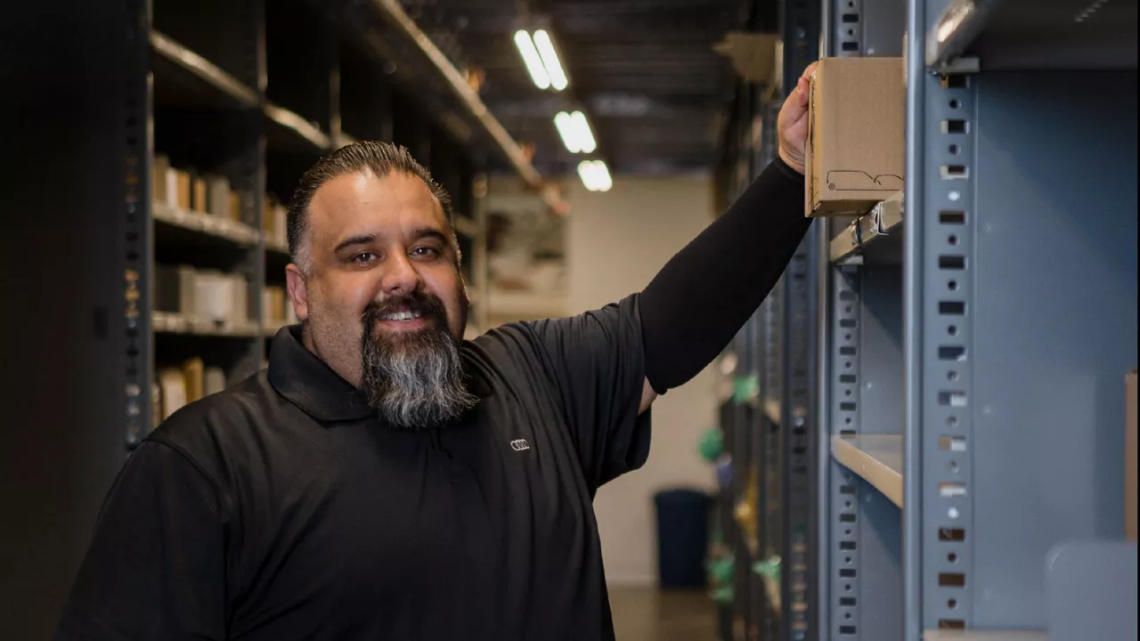 Man working in storage room. 