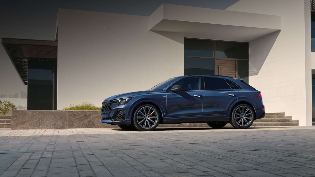 Audi Q8 SUV outside a modern building