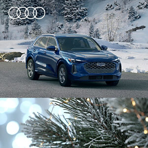 Driver side view of New Audi Q5 parked.