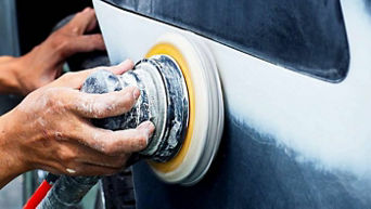 Service technician servicing cars