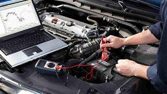 Service technician serving vehicle.