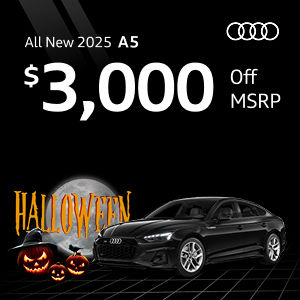 Back view of an Audi A5 driving.