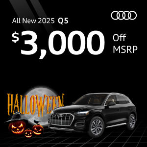 Side view of an Audi Q5 parked.