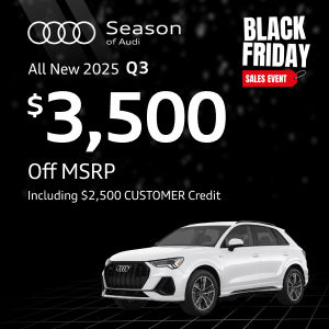 Side view of an Audi Q3 driving.