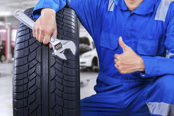 An Audi technician servicing a vehicle