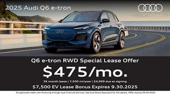 Audi Q6 e-tron driving near the coast.