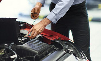 Service technician servicing battery.
