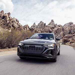 Front view of an Audi Q8 driving