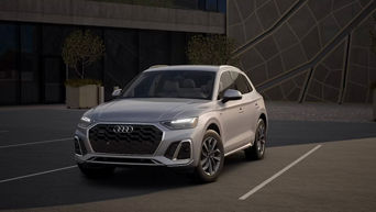 Three quarter profile view of an Audi Q5 parked.