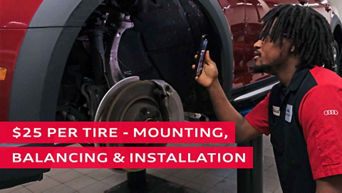 Technician inspecting the tires of the vehicle