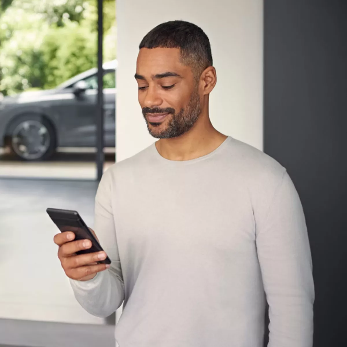 Audi customer on their phone 