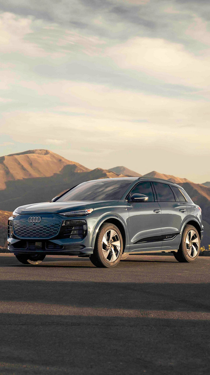 Right side profile view of an all-new Audi Q6 e-tron parked.