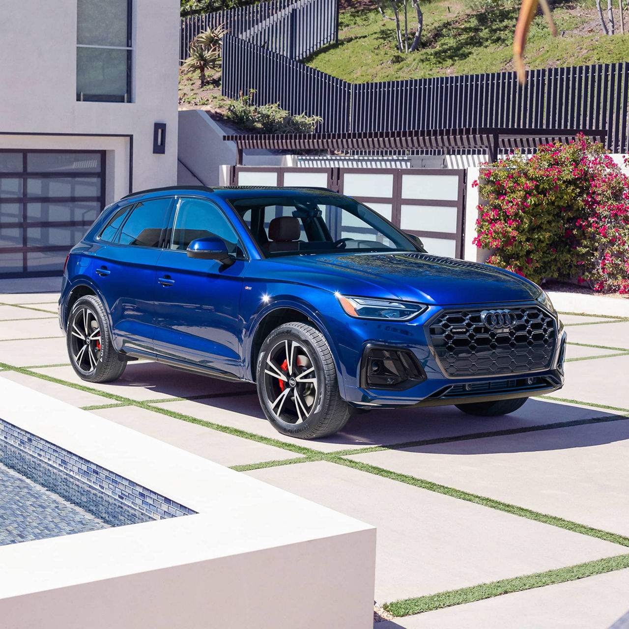 Three quarter profile view of an Audi Q5 parked.