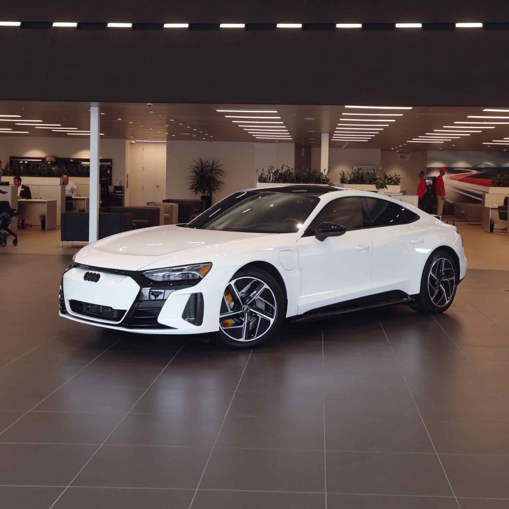 Three-quarter front profile of an Audi vehicle.