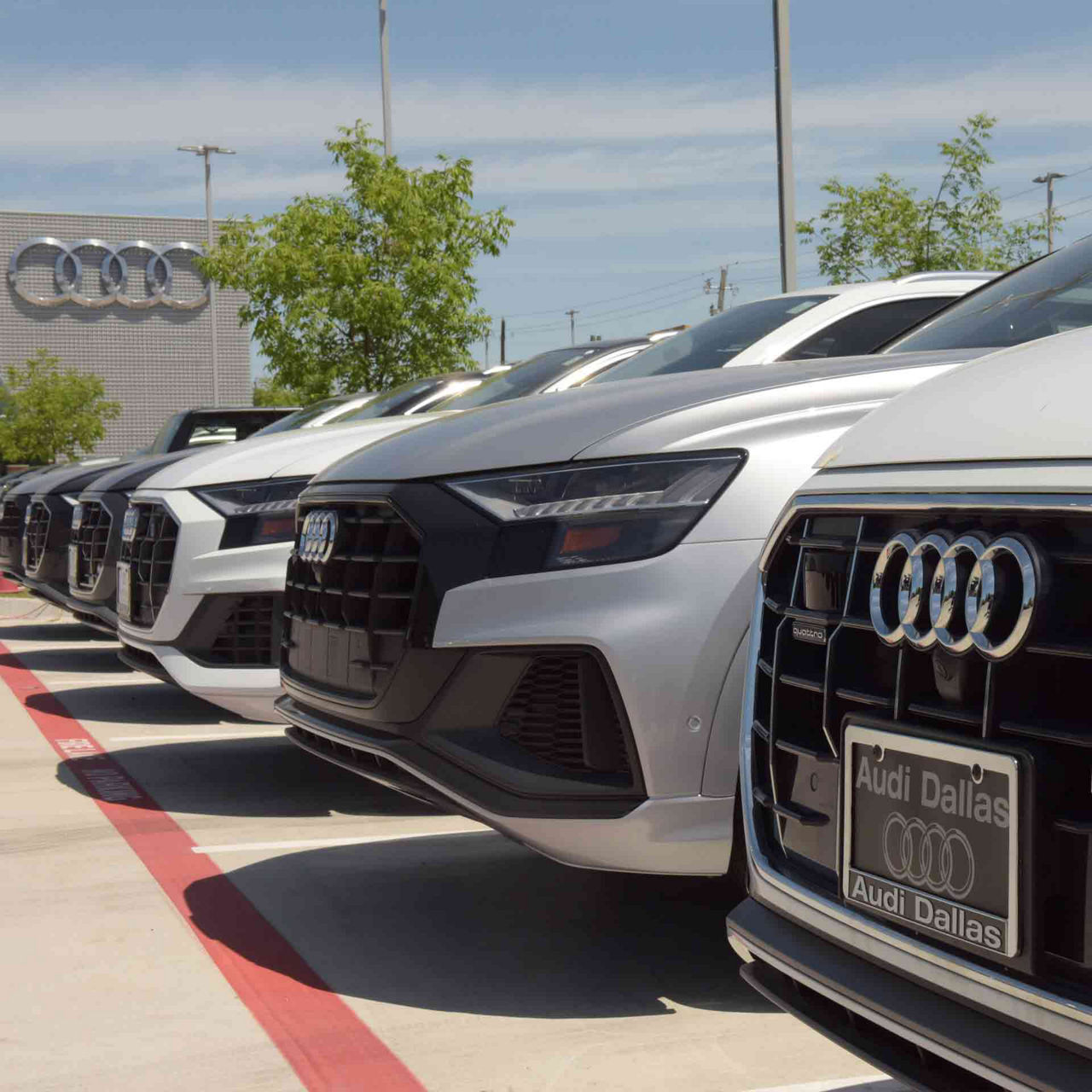 Close-up of a fleet of Audi vehicles. 