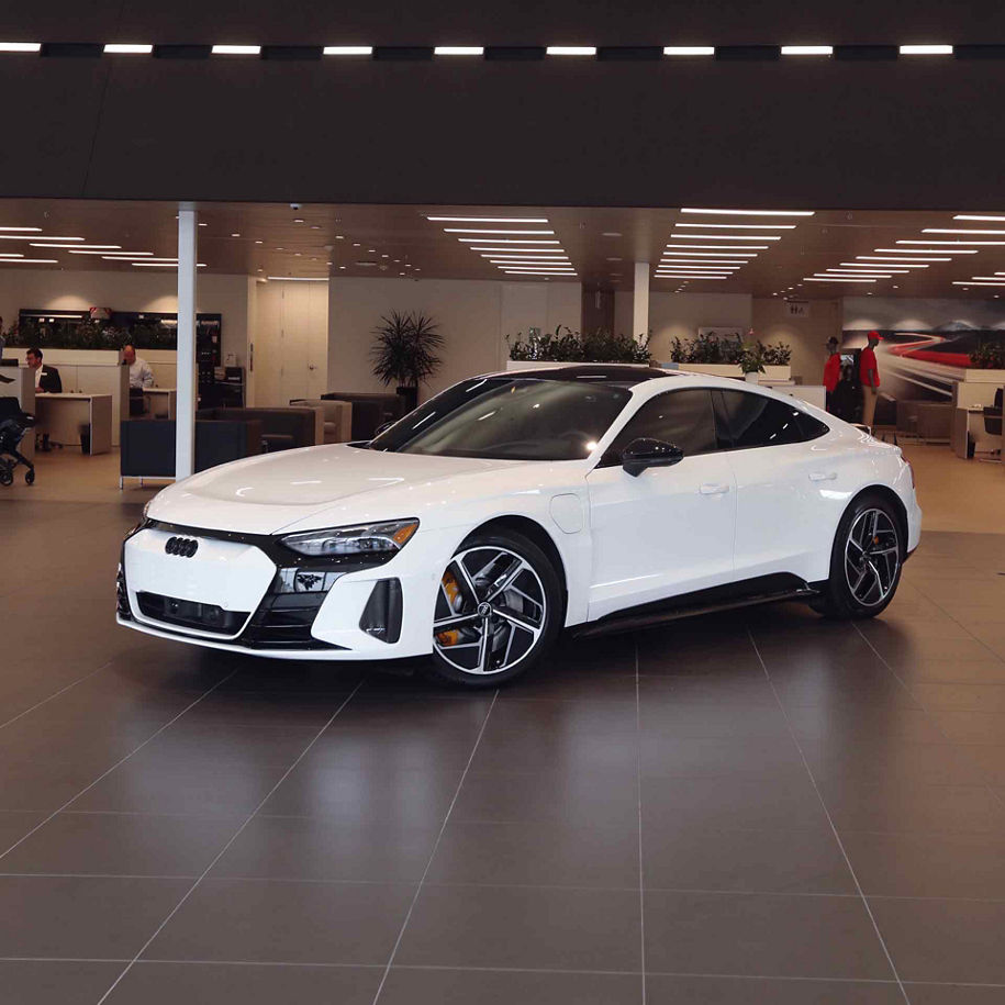 Three-quarter front profile of an Audi vehicle.