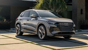 Three-quarter front profile view of an Audi Q4 e-tron, parked.