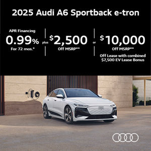 Audi A6 Sportback e-tron parked along the side of a building