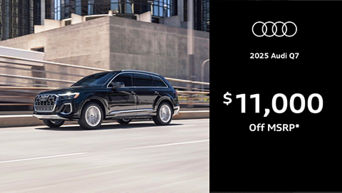 Audi Q7 driving along road