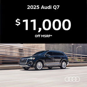 Audi Q7 driving along road
