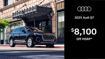 Audi Q7 driving along road